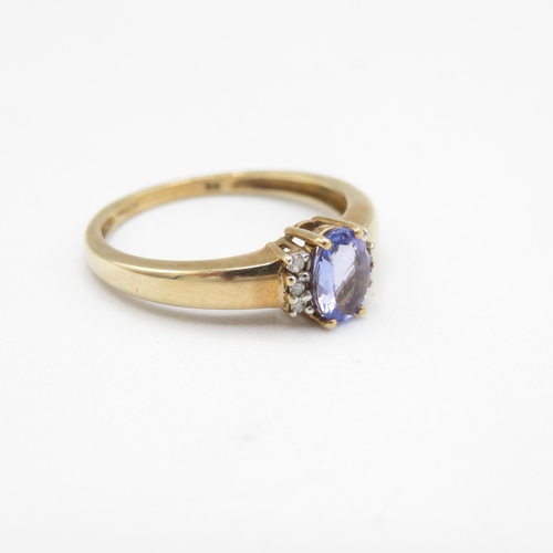 236 - 9ct gold oval cut tanzanite & diamond dress ring (2.1g) Size  P