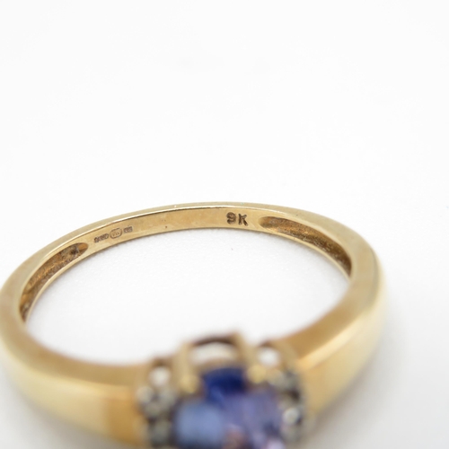 236 - 9ct gold oval cut tanzanite & diamond dress ring (2.1g) Size  P