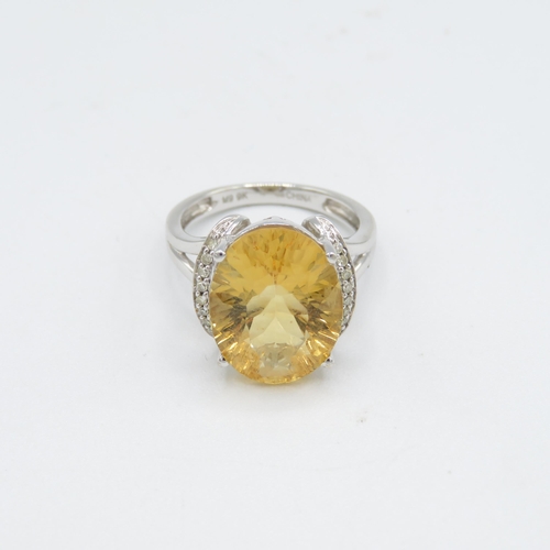 275 - 9ct gold oval cut citrine & diamond dress ring (5g) Size  O