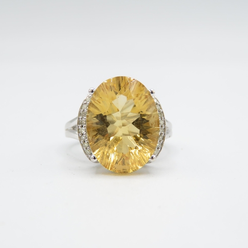 275 - 9ct gold oval cut citrine & diamond dress ring (5g) Size  O