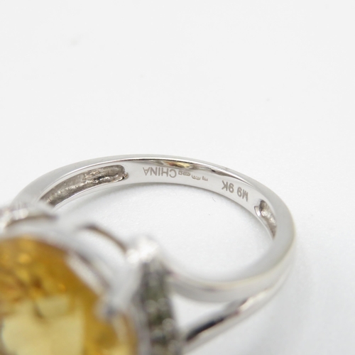 275 - 9ct gold oval cut citrine & diamond dress ring (5g) Size  O