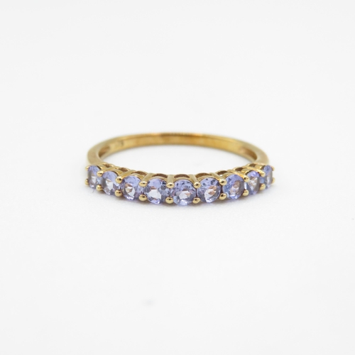 279 - 9ct gold tanzanite half eternity ring, claw set (1.4g) Size  P