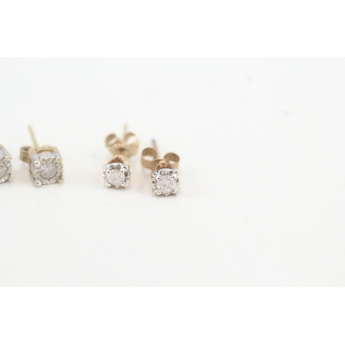 129 - 2 x 9ct gold diamond stud earrings (1.5g)