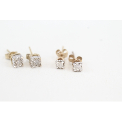 129 - 2 x 9ct gold diamond stud earrings (1.5g)