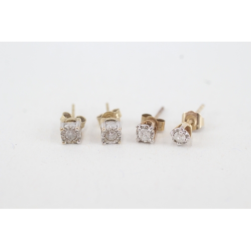 129 - 2 x 9ct gold diamond stud earrings (1.5g)