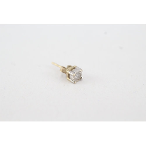 129 - 2 x 9ct gold diamond stud earrings (1.5g)