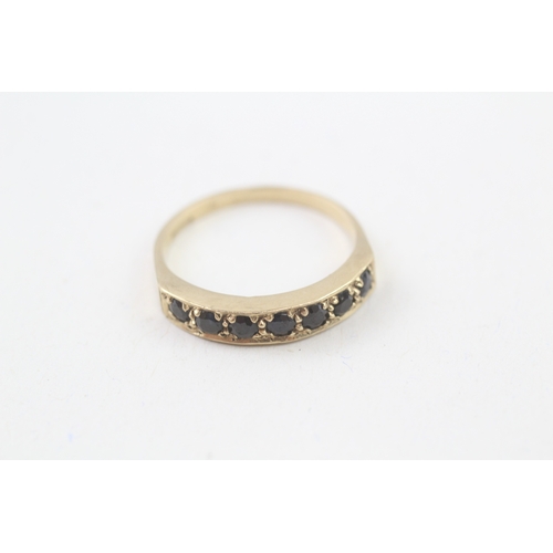 133 - 9ct gold sapphire half eternity ring (2.4g) Size  R