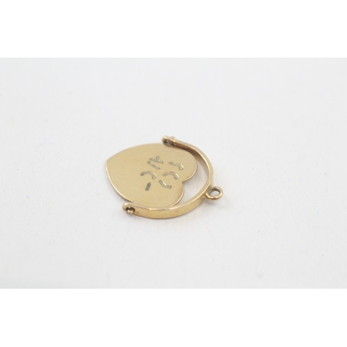 24 - 9ct gold vintage 'I love you' spinning heart shape charm (1.1g)