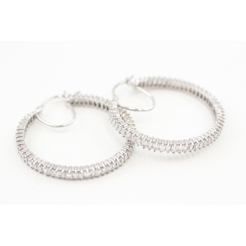 74 - 9ct white gold baguette cut cubic zirconia hoop earrings, claw set (8.2g)