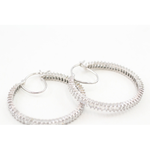 74 - 9ct white gold baguette cut cubic zirconia hoop earrings, claw set (8.2g)