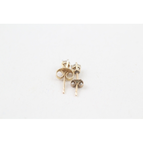 79 - 9ct gold diamond single stone stud earrings (0.4g)