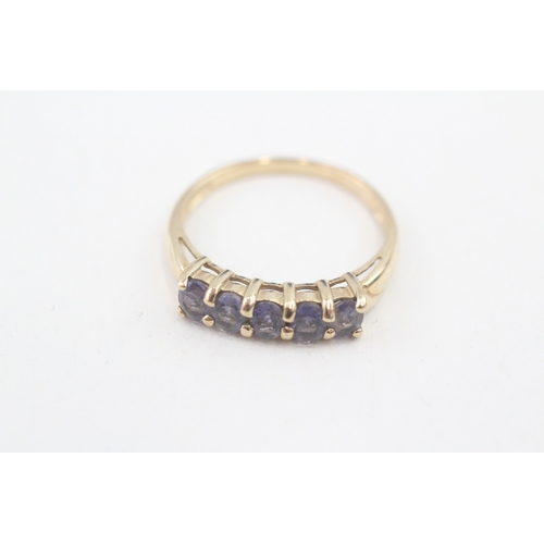 94 - 9ct gold tanzanite set five stone eternity ring (1.9g) Size  P 1/2