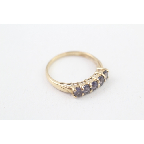 94 - 9ct gold tanzanite set five stone eternity ring (1.9g) Size  P 1/2