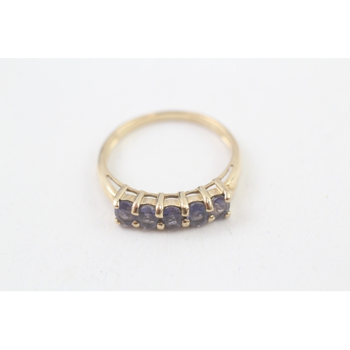 94 - 9ct gold tanzanite set five stone eternity ring (1.9g) Size  P 1/2