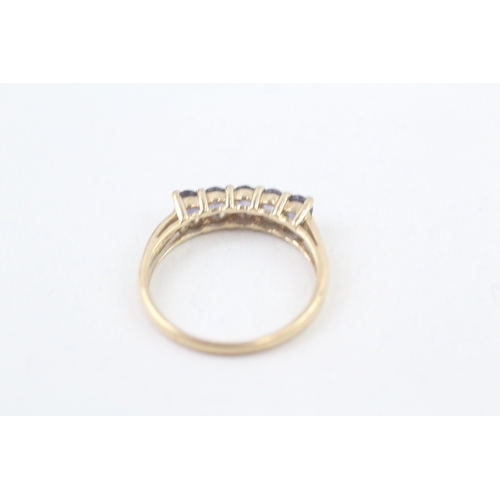 94 - 9ct gold tanzanite set five stone eternity ring (1.9g) Size  P 1/2