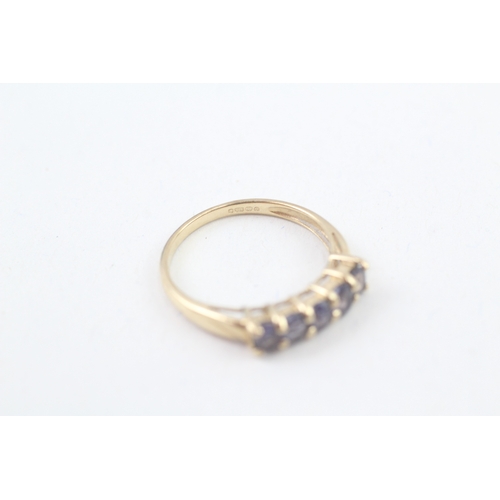 94 - 9ct gold tanzanite set five stone eternity ring (1.9g) Size  P 1/2