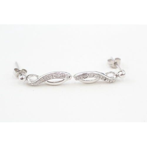 99 - 9ct white gold diamond set ribbon drop earrings (2.3g)