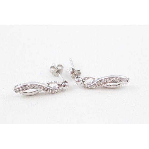 99 - 9ct white gold diamond set ribbon drop earrings (2.3g)