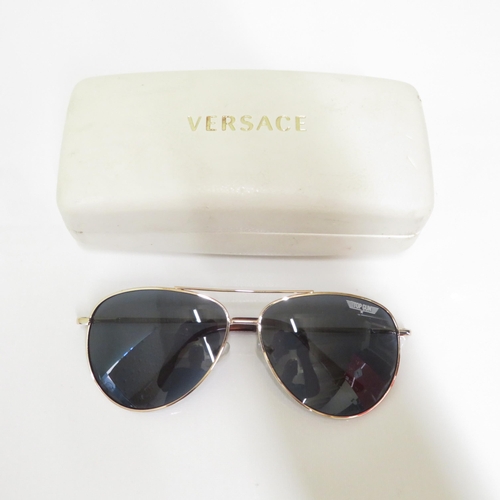 486 - 4 x Designer Sunglasses including Oakley, Police, Guess, Versace  - All with Cases