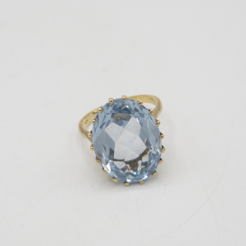 48 - 9ct gold oval cut blue gemstone dress ring, claw set (7.7g) Size  R 1/2