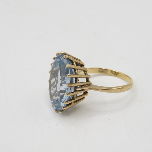 48 - 9ct gold oval cut blue gemstone dress ring, claw set (7.7g) Size  R 1/2