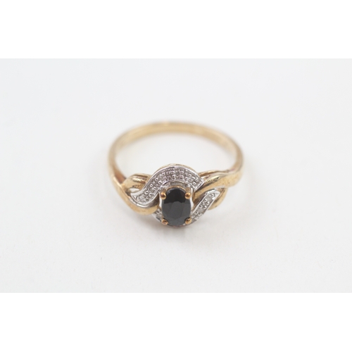 122 - 9ct gold sapphire single stone ring with diamond surround (2.4g) Size  P