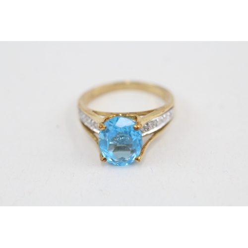 14 - 9ct gold oval cut blue topaz & diamond dress ring (3.1g) Size  M 1/2