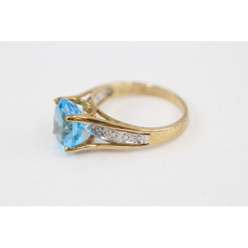 14 - 9ct gold oval cut blue topaz & diamond dress ring (3.1g) Size  M 1/2