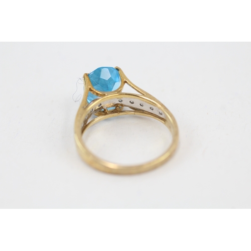 14 - 9ct gold oval cut blue topaz & diamond dress ring (3.1g) Size  M 1/2