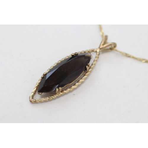 22 - 9ct gold marquise cut smokey quartz pendant necklace (3g)