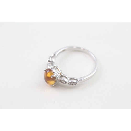 29 - 9ct white gold oval cabochon citrine single stone ring (2.4g) Size  O