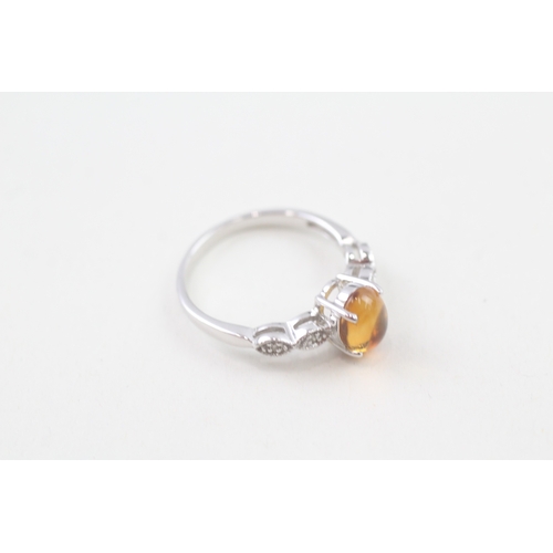 29 - 9ct white gold oval cabochon citrine single stone ring (2.4g) Size  O