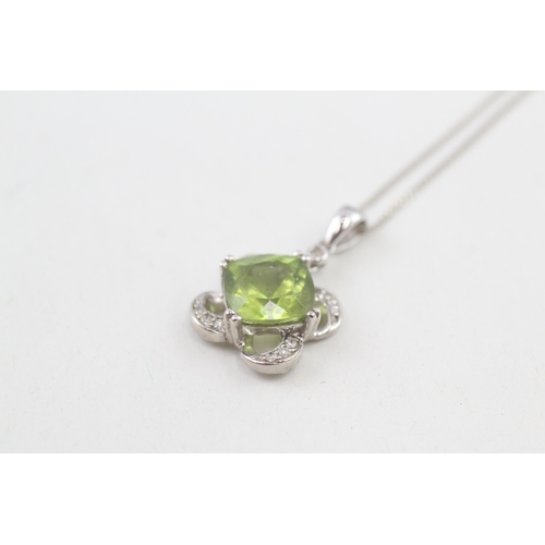 38 - 9ct white gold diamond & peridot clover pendant necklace (2.8g)