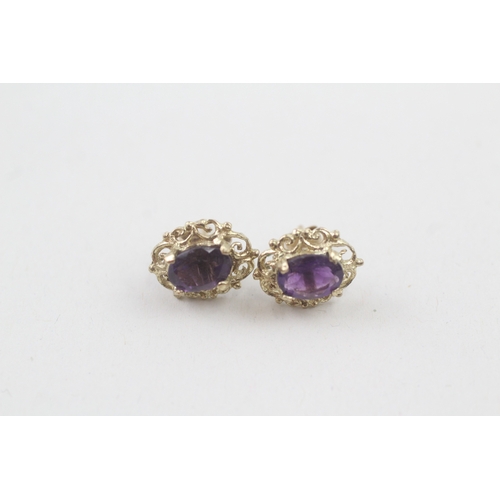 39 - 9ct gold amethyst single stone stud earrings (1.6g)