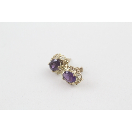 39 - 9ct gold amethyst single stone stud earrings (1.6g)