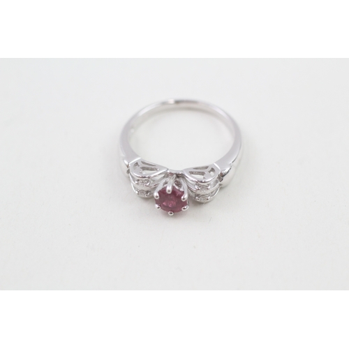 40 - 9ct white gold pink tourmaline single stone ring with diamond set openwork shoulders (2.7g) Size  N ... 