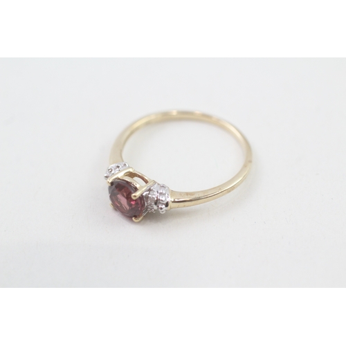 51 - 9ct gold garnet single stone ring with diamond sides (2.1g) Size  Q