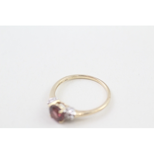 51 - 9ct gold garnet single stone ring with diamond sides (2.1g) Size  Q