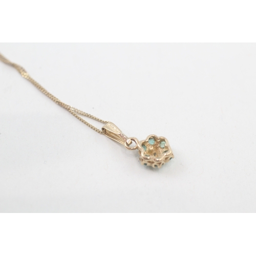 53 - 9ct gold diamond & emerald floral cluster pendant necklace (1.3g)