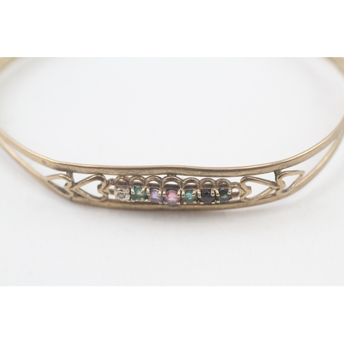 54 - 9ct gold 'DEAREST' cuff bangle set with diamond, emerald, amethyst, ruby, sapphire & tourmaline (5.1... 