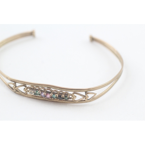 54 - 9ct gold 'DEAREST' cuff bangle set with diamond, emerald, amethyst, ruby, sapphire & tourmaline (5.1... 