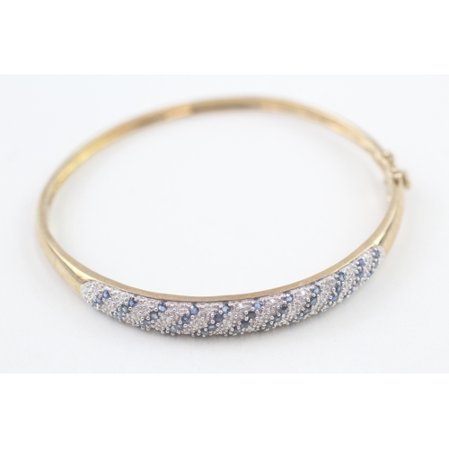 60 - 9ct gold diamond & sapphire hinged bangle (11g)