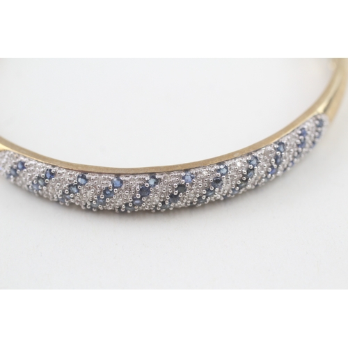 60 - 9ct gold diamond & sapphire hinged bangle (11g)