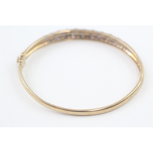 60 - 9ct gold diamond & sapphire hinged bangle (11g)