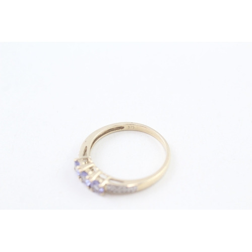 73 - 9ct gold tanzanite & diamond dress ring, claw set (1.8g) Size  P