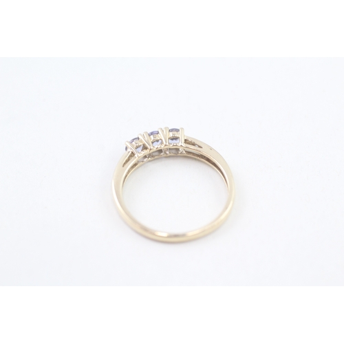 73 - 9ct gold tanzanite & diamond dress ring, claw set (1.8g) Size  P