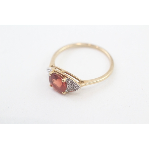 88 - 9ct gold diamond & red gemstone dress ring (2.6g) Size  R 1/2