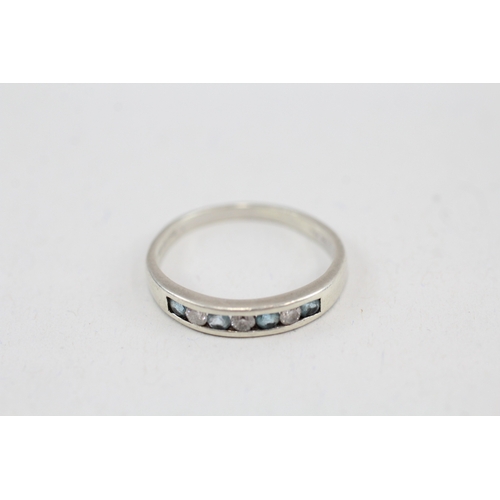 101 - 9ct white gold diamond & topaz seven stone ring (2g) Size  N 1/2