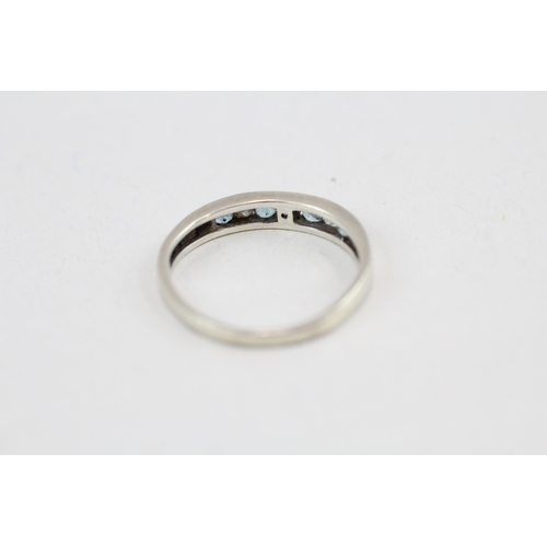 101 - 9ct white gold diamond & topaz seven stone ring (2g) Size  N 1/2