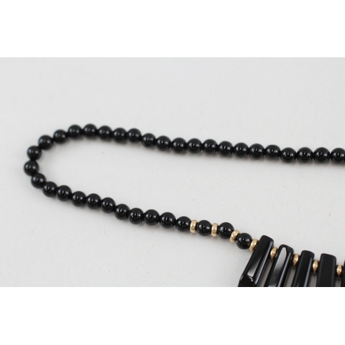 102 - 2x 9ct gold black onyx necklaces (40.4g)